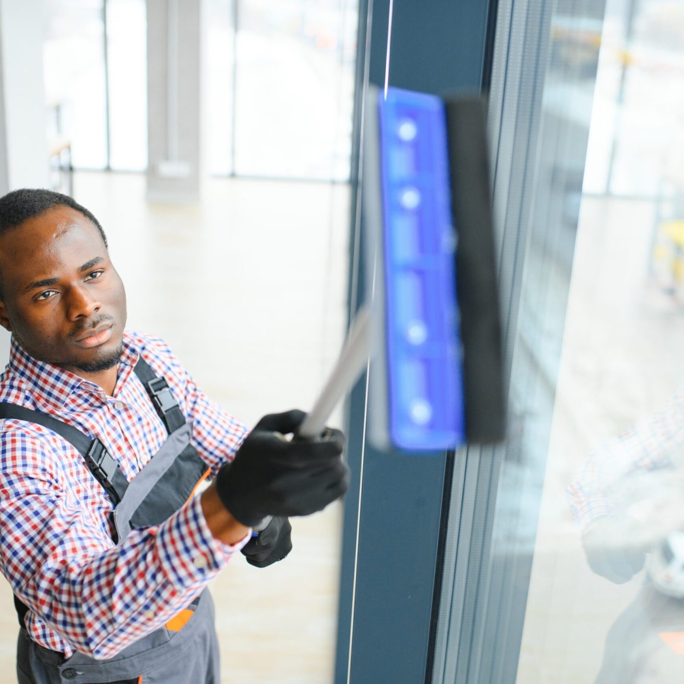 African,Male,Professional,Cleaning,Service,Worker,In,Overalls,Cleans,The